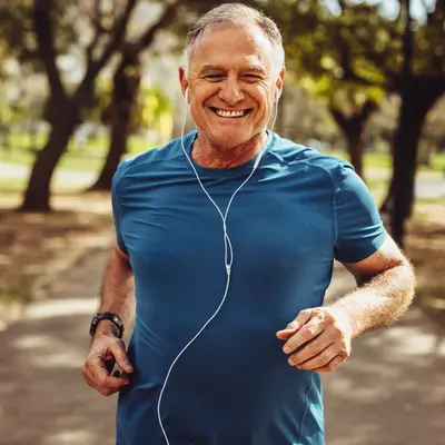 smiling man running